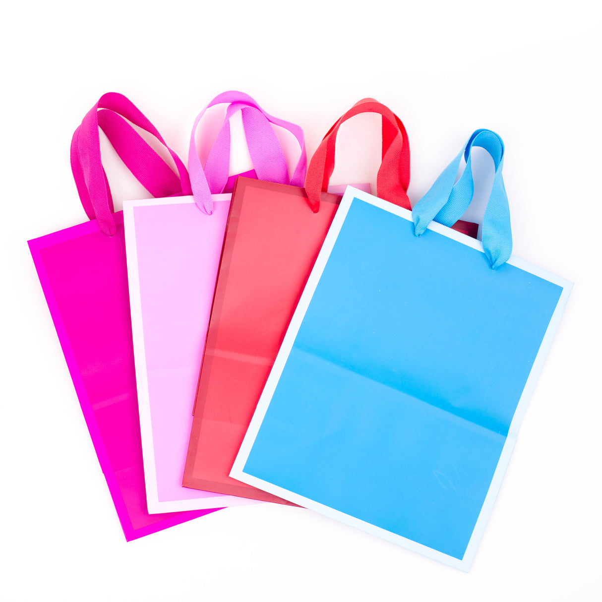 9" Medium Solid Color Gift Bags - Pack of 4 in Red, Blue, Light Pink and Hot Pink for Birthdays, Baby Showers, Retirements or Any Occasion