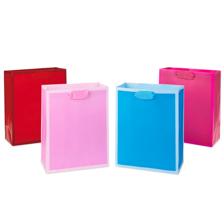 9" Medium Solid Color Gift Bags - Pack of 4 in Red, Blue, Light Pink and Hot Pink for Birthdays, Baby Showers, Retirements or Any Occasion